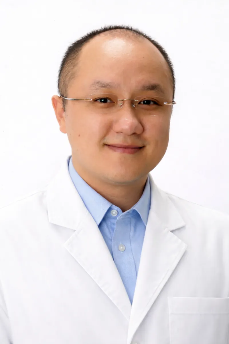 Dr. Leshin Chen, DDS, DABP — board-certified periodontist and implant specialist at Ling Zhu DDS